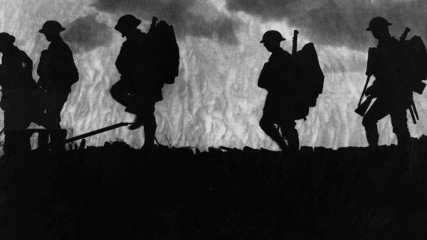 Soldiers walking on a ridge from World War I